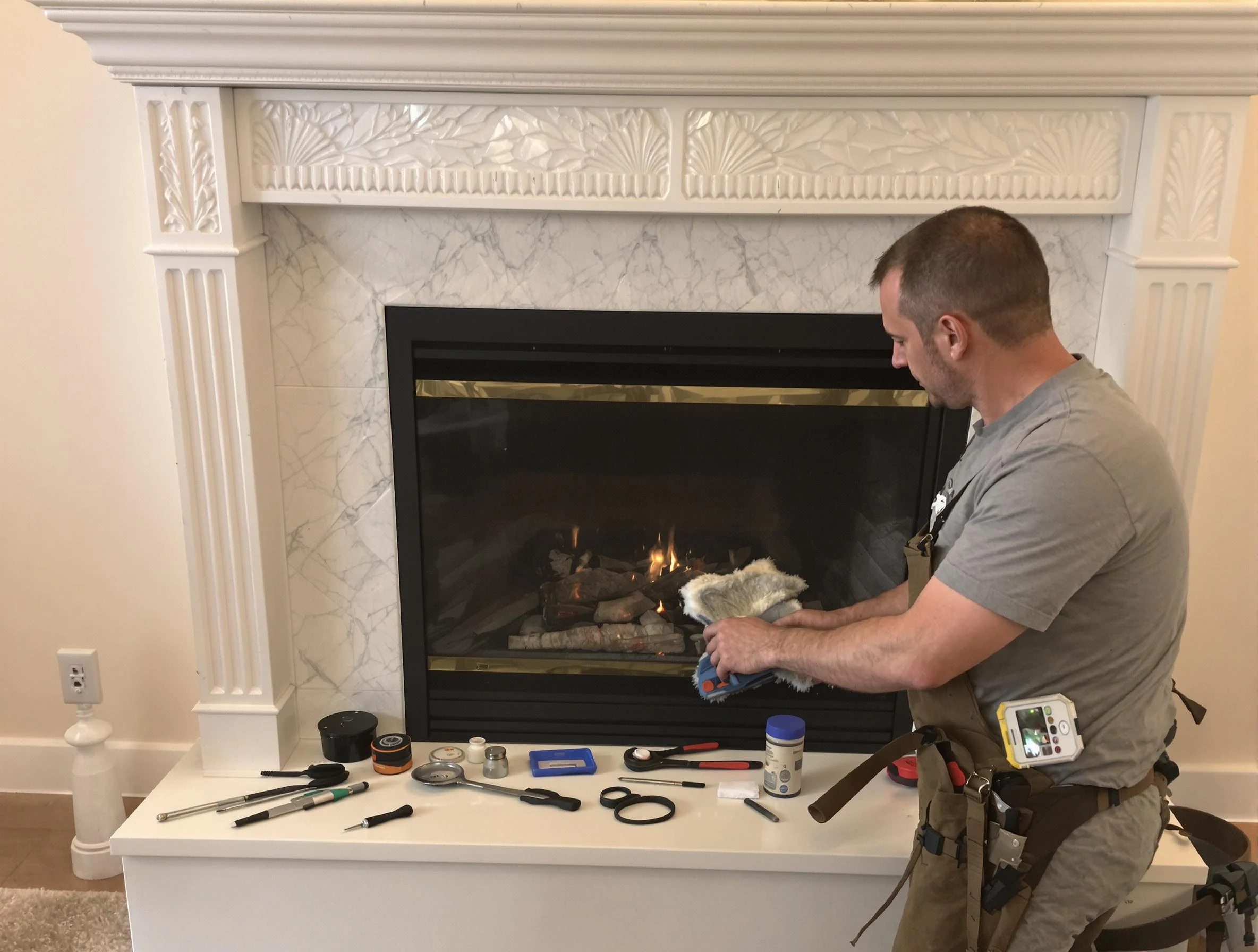 Woburn Chimney Sweep performing fireplace maintenance in Woburn, MA